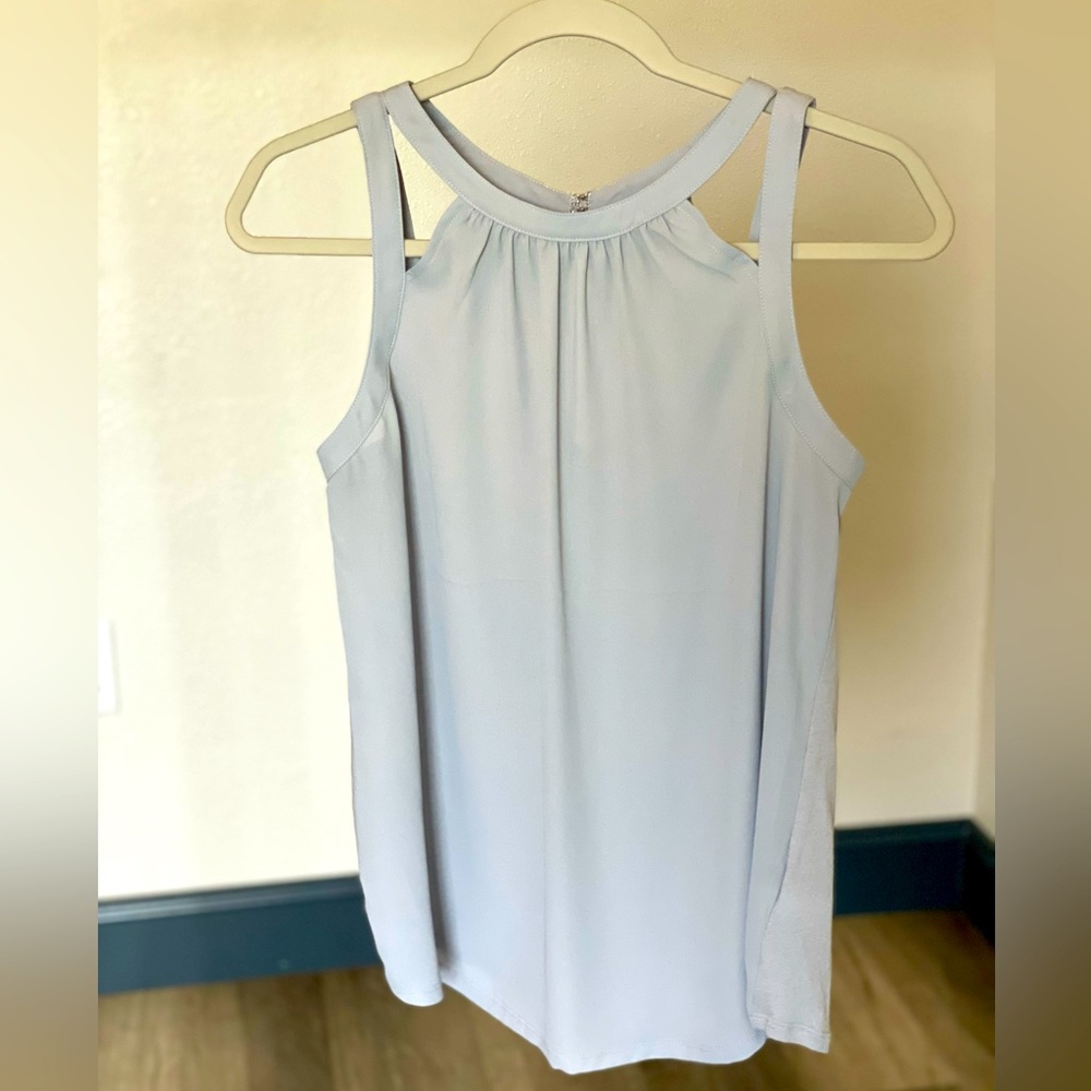 Sleeveless light blue blouse